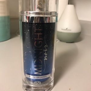Midnight black bronzer tanning lotion